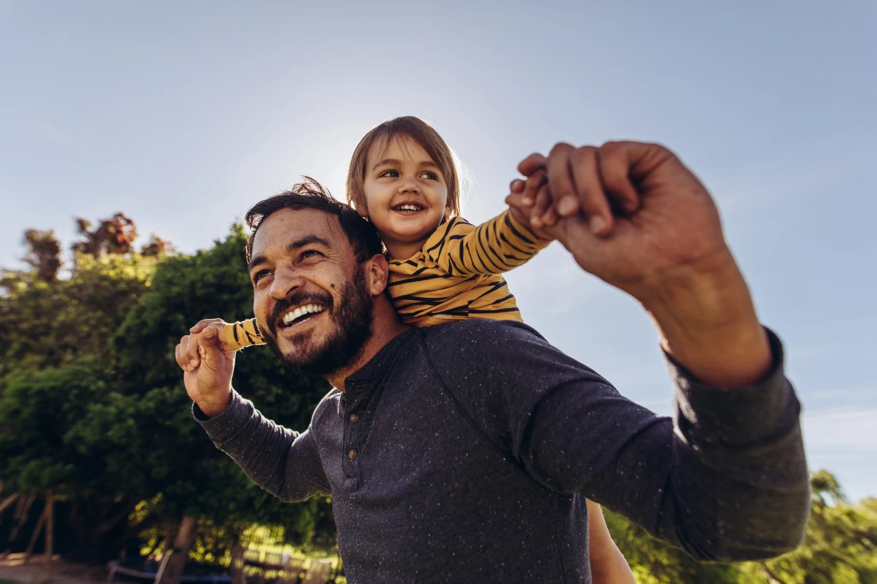 Man smiling with kids