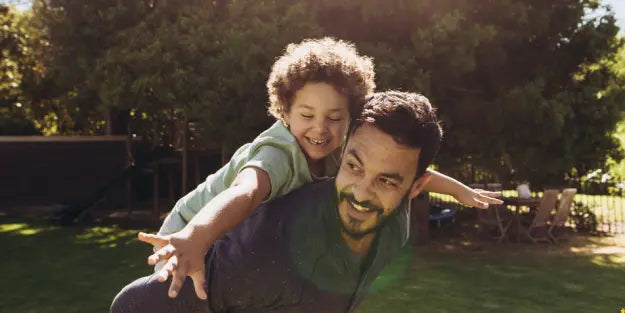 Father and son playing in the yard