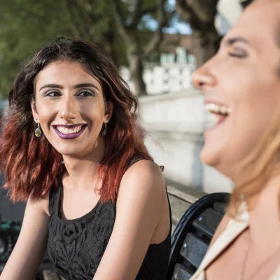 Two transgender women laughing