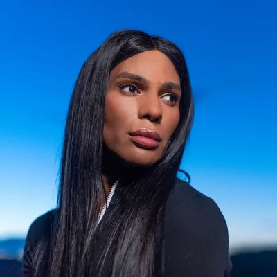 Transgender woman looking to the left in a sweatshirt