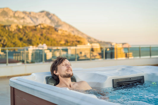 Man enjoying a hot tub on a roof
