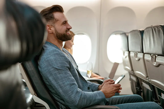 Man on airplane smiling