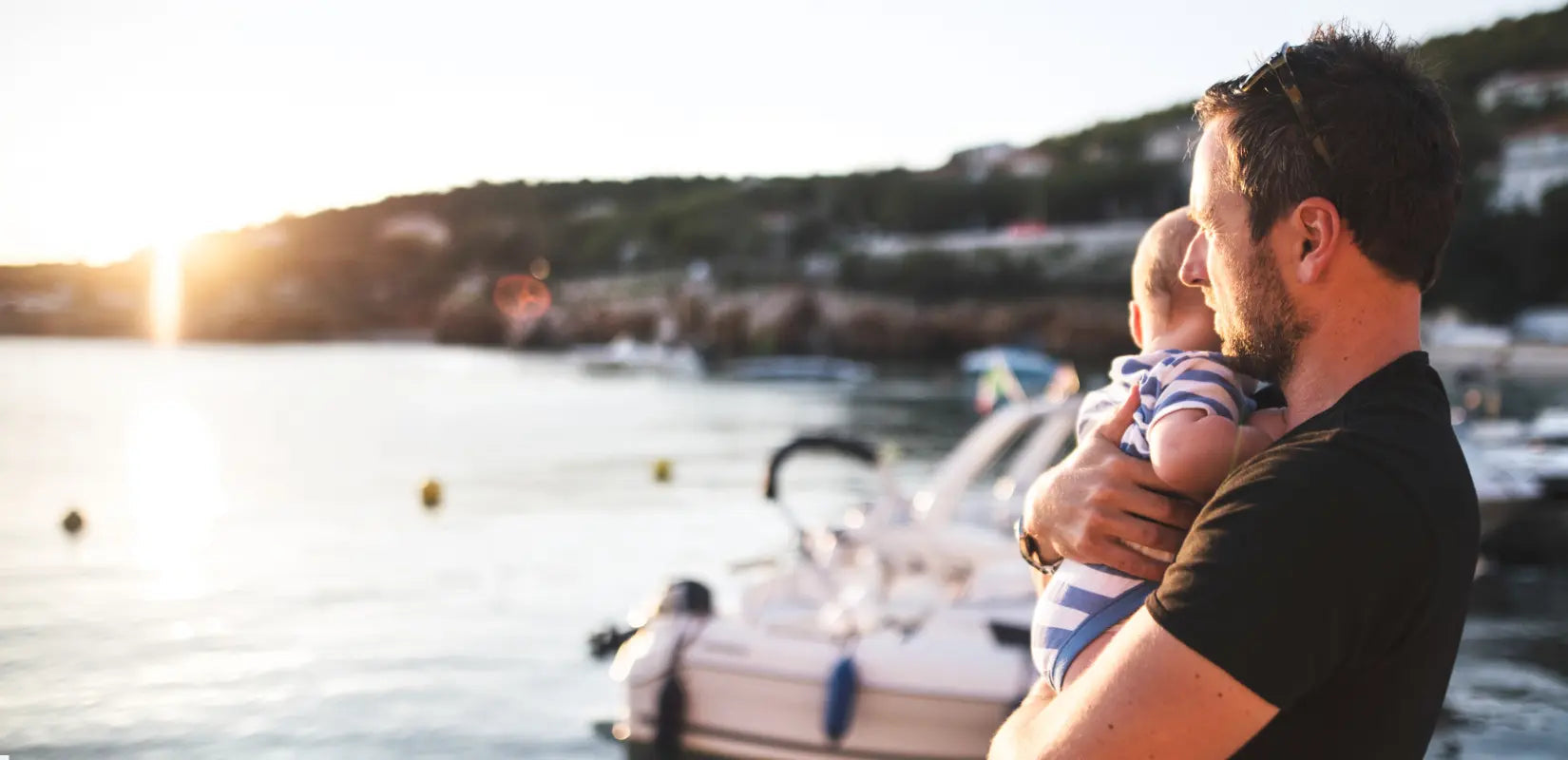 Man holding baby after he preserved his sperm with CryoChoice