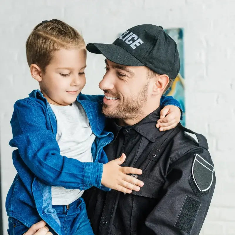 Police officer holding child